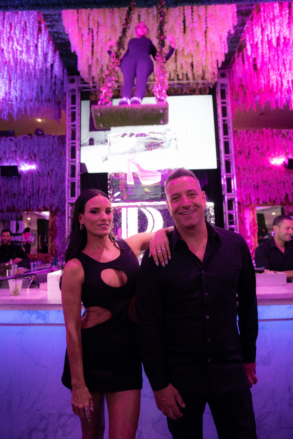 Guests at the D'Amelio Footwear launch party step and repeat