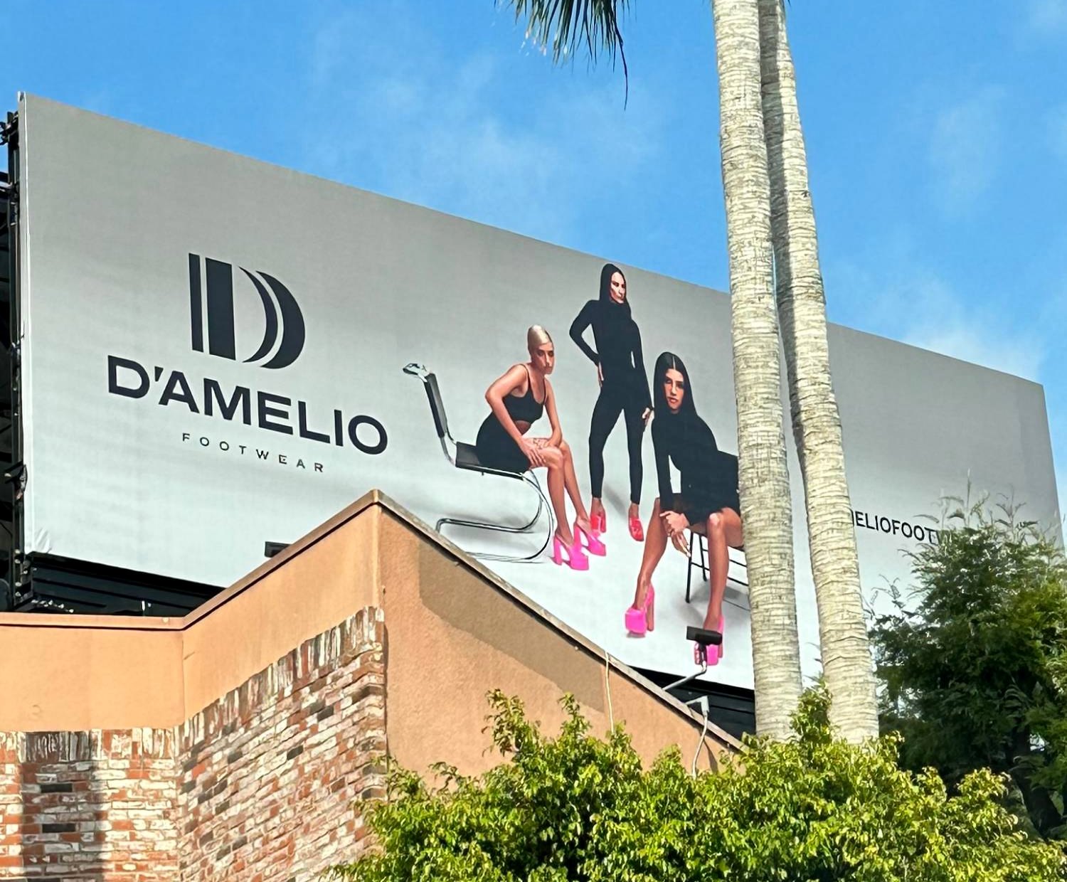 A D'Amelio Footwear billboard advertisement on Sunset Boulevard in Los Angeles